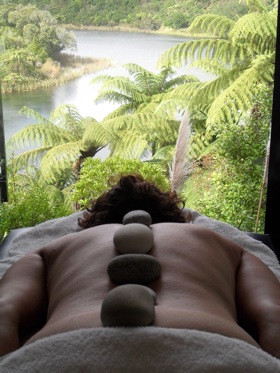 Woman in Rotorua receiving a hot stone mirimiri massage